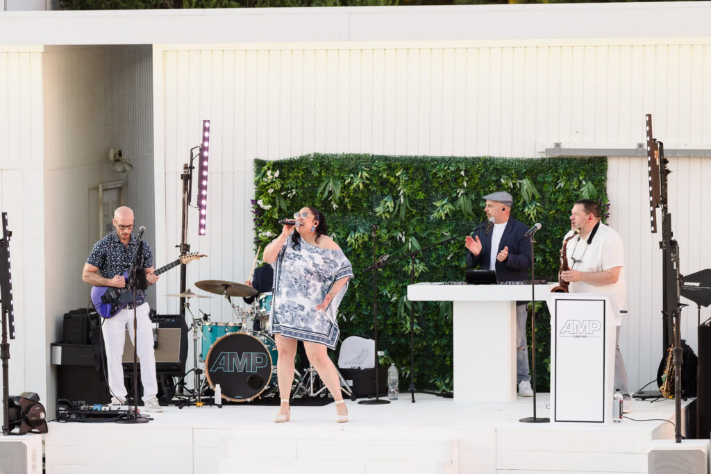 Live band performing on the outdoor stage beside the Great Lawn at EHP Resort in East Hampton.