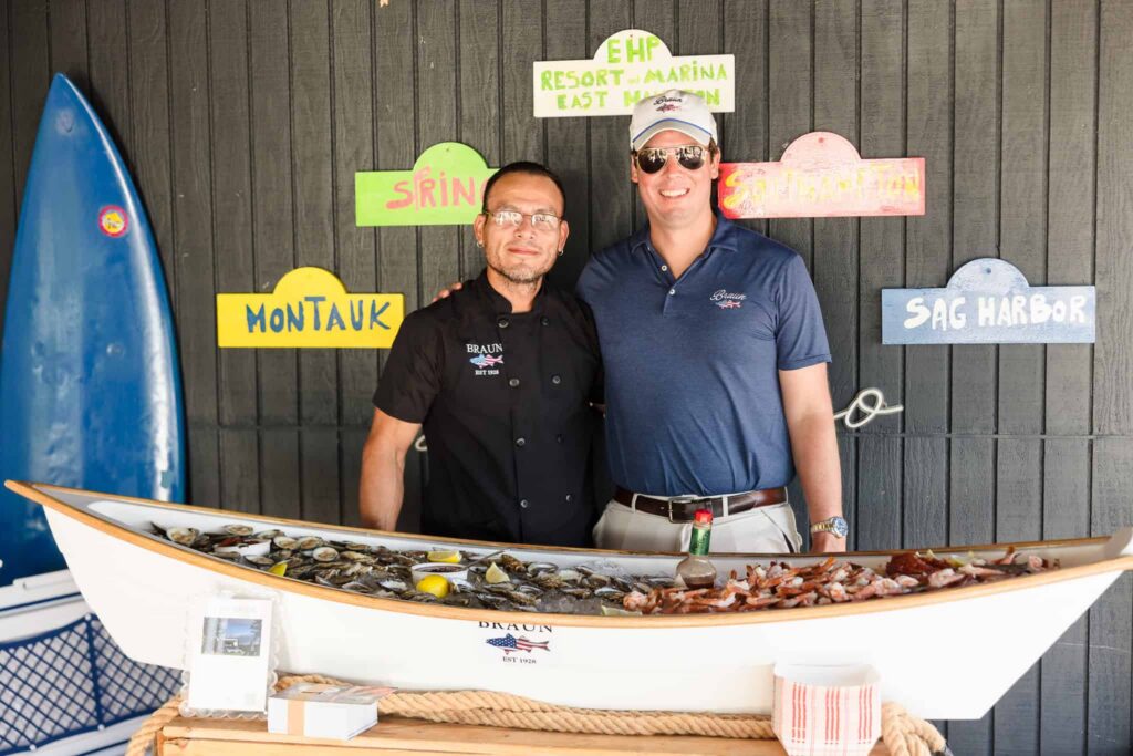 Oyster and raw bar display with two vendors at the East End wedding community event at EHP Resort.