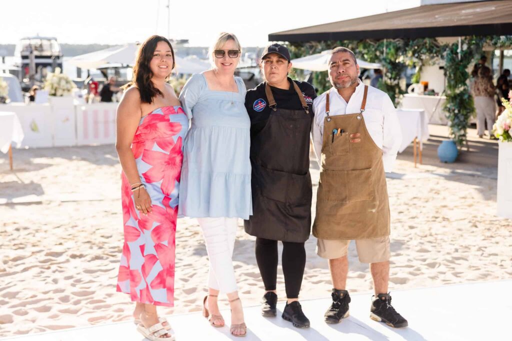 Wedding industry vendors gathered on the sand during A Toast to Summer at EHP Resort and Marina.
