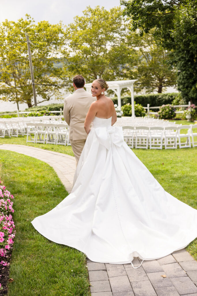 Quinn approaching Josh for their first look in the garden at Sea Cliff Manor.