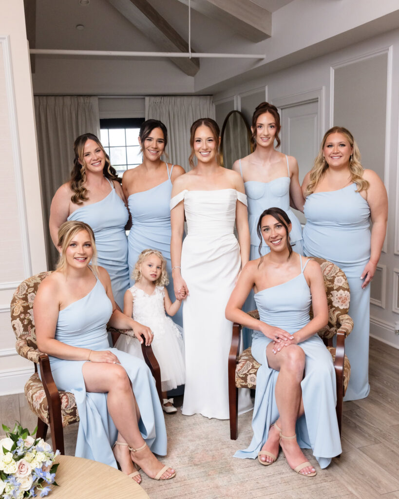 Bride with her bridesmaids and flower girl in the bridal suite during a Swan Club wedding in Roslyn.